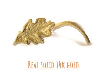 Könnte beinhalten: Ein Nasenring aus einem goldenen Blatt aus massivem 14 Karat Gold. REAL SOLID 14K GOLD.