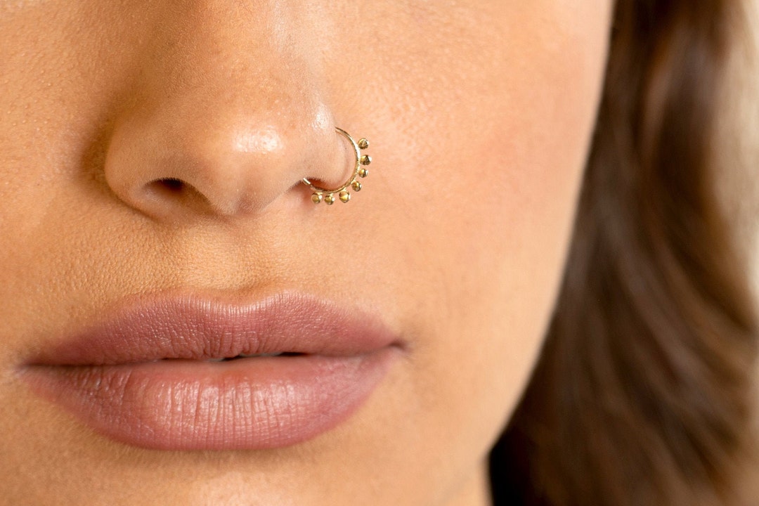 How to get retail a stuck nose hoop out