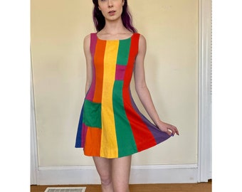 Vintage 1950s full swing dress with rainbow stripes in chevron style pattern dolman sleeve