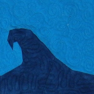 May include: A dark blue wave cresting over a bright blue background. The wave is textured and appears to be made of fabric.