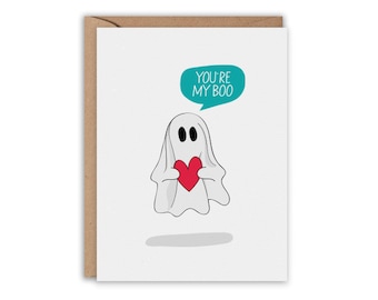 May include: A white ghost holding a red heart with a speech bubble above it that says "You're My Boo".