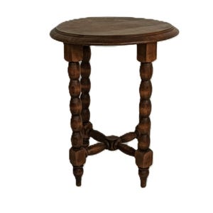 May include: A small, round wooden side table with a dark brown finish. The table has a circular top and intricately carved legs with a bobbin design. The legs are connected by a cross-shaped base. The table is approximately 61 cm tall.