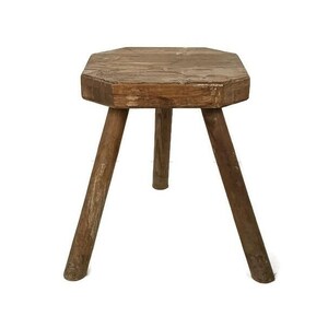 May include: A rustic wooden stool with three legs and a hexagonal top. The stool is made of natural wood and has a weathered finish.