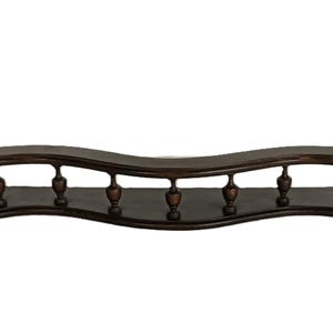 May include: A dark brown, wooden shelf with a wavy design. The shelf has a lower level and an upper level with decorative balusters. The shelf is approximately 36 inches long.