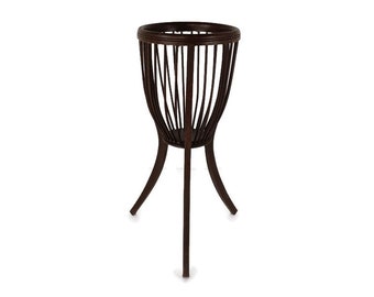 May include: A dark brown wooden plant stand with a round, slatted planter on top and three legs.
