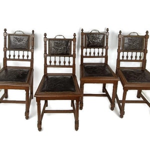 RESERVED set of 4 Antique  Gothic 1900s Chairs  Ornate Heavy Wood Renaissance  Dragons Leather