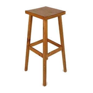 May include: A wooden bar stool with a square seat and a single, square-shaped support bar. The stool is made of natural wood with a light brown finish.