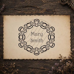 May include: A rectangular piece of cream-colored paper with scalloped edges featuring a black circular Celtic knot border design. The text Mary Smith is printed in the center of the knotwork in a dark, stylized serif font.