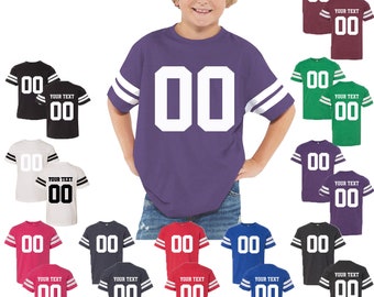 May include: A collection of short-sleeved jersey t-shirts featuring two white stripes on each sleeve and the number 00 printed on the front. Some shirts include the text YOUR TEXT above the number 00. Available in purple, black, white, pink, dark gray, red, blue, maroon, and green.