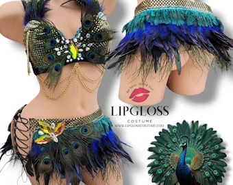 May include: Peacock-themed costume set with a bra top, skirt, and belt. The bra top features a peacock design with iridescent sequins and gold chains. The skirt is made of peacock feathers and has a lace-up detail on the side. The belt is also made of peacock feathers and has a gold chain detail.