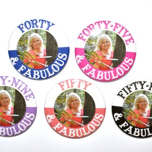 May include: Six round buttons with a white background and a photo of a woman in the center. Each button has a different age and the text "& Fabulous" around the photo. The ages are: Forty, Forty-Five, Forty-Nine, Fifty, Fifty-Five.