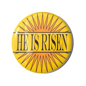 May include: A yellow button with a sunburst design and the text "HE IS RISEN" in black.