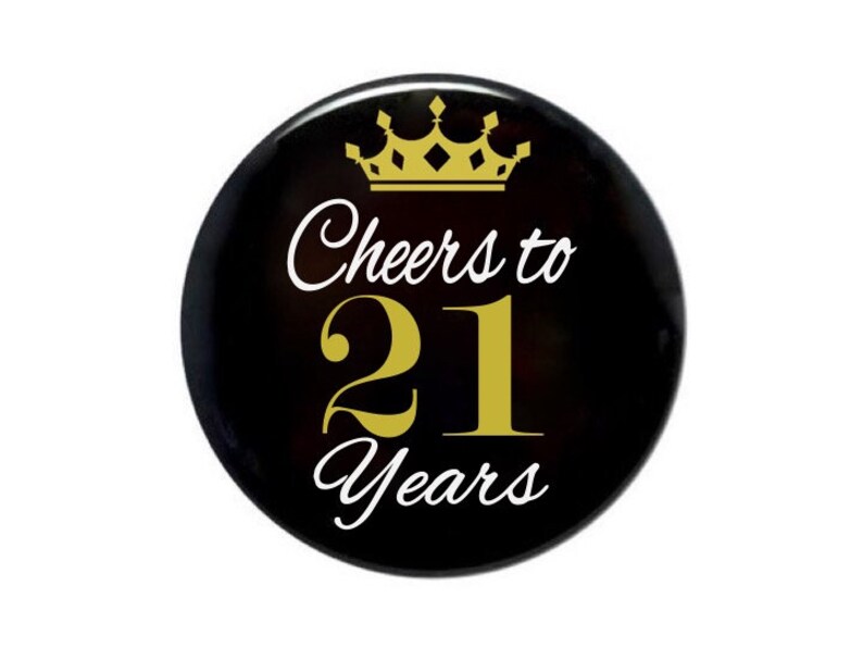 May include: Black button with a gold crown and the text "Cheers to 21 Years" in white.