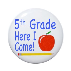 May include: A white button with the text "5th Grade Here I Come!" in blue. A red apple with a green leaf and a yellow pencil are also featured on the button.