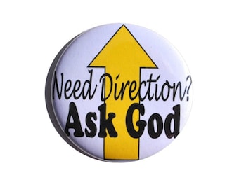 May include: A white button with a yellow arrow pointing upwards. The button says "Need Direction? Ask God."