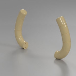 Puede incluir: Dos asas de plástico beige con forma redondeada y una serie de pequeños segmentos cilíndricos. Las asas son curvadas y tienen un acabado liso y brillante.