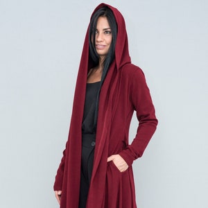 Red swing coat with hood for every day use or special occasion.
Long maxi steampunk coat with belt and long sleeves.
Womens capes coats from knitted fabric. 
Hooded cardigan for plus size ladies is a great even as comfy maternity clothes .