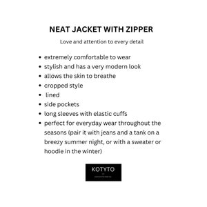 May include: A black and white text description of a jacket with a zipper. The text highlights the features of the jacket, such as its comfort, style, and versatility. The text also mentions that the jacket is lined and has side pockets.