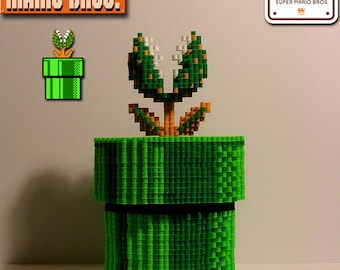 May include: A pixelated Piranha Plant emerging from a green pipe, a recognizable element from the Super Mario Bros. video game series. The image also includes the Super Mario Bros. logo and a 30th-anniversary emblem.