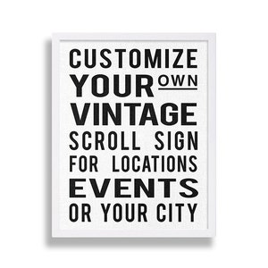 May include: White framed sign with black text that reads "Customize Your Own Vintage Scroll Sign For Locations Events Or Your City"