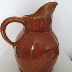 Lovely old French provincial pitcher in a warm honey-coloured glaze.