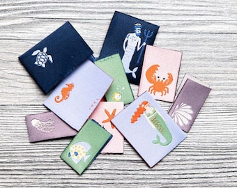 Juego de etiquetas tejidas de 100 % poliéster (rPET) "The Coral Club", 6 piezas, para uso en textiles, 9302