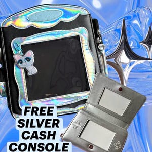 May include: A black backpack with iridescent trim, a clear front pocket, and a cat charm, paired with a silver wallet shaped like a handheld gaming console. The text on the image reads: FREE SILVER CASH CONSOLE WALLET!