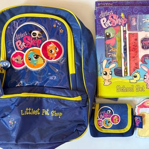 May include: A collection of Littlest Pet Shop merchandise, including a blue backpack with yellow trim, a pencil case, a school set, and a grocery list. The backpack features character graphics and the words 'Littlest Pet Shop'.