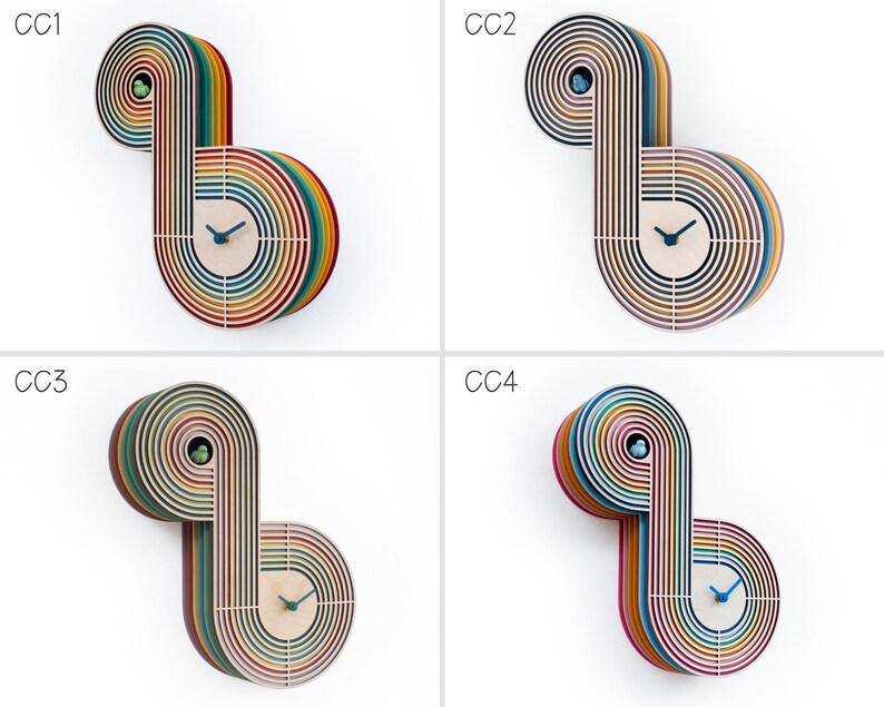 May include: Four colorful wooden clocks with a rainbow design. Each clock has a different color scheme and is labeled with the letters CC1, CC2, CC3, and CC4.