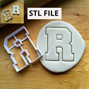 May include: A white plastic letter "R" cookie cutter and a cut-out "R" in dough are shown. The text "STL FILE" is displayed in a white rectangle. The cutter is designed to create a block letter "R".