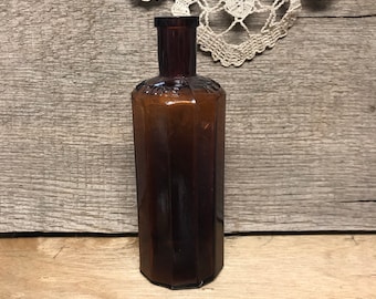 Antique bottle, veterinarian, horse, ponies, medicine, spavin cure, enosburch falls,vermont, amber, cylindrical , flat sided, old bottle