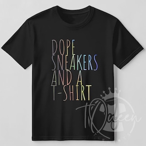 May include: Black t-shirt with rainbow text that reads "Dope Sneakers and a T-shirt".