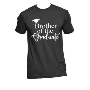 May include: Black t-shirt with white text that reads "Brother of the Graduate" and a graduation cap graphic.