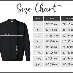 May include: Black sweatshirt with a size chart. The chart lists chest and length measurements in inches and centimeters for sizes S to 5XL. The text "Size Chart" is at the top.