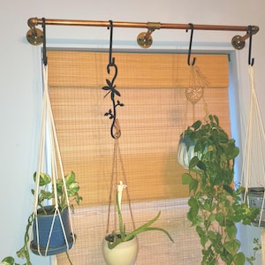 Vintage Looking Brass Wall or Ceiling Hanging Plant Holder, Featuring a Rustic Metal Pipe Design For Indoor Plants, Enhances Home Decor