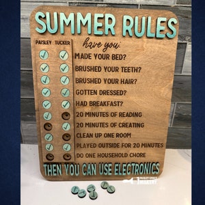 May include: A wooden sign with the text "SUMMER RULES" in blue and white lettering. The sign has a checklist with tasks for children to complete before using electronics. The tasks include making their bed, brushing their teeth, brushing their hair, getting dressed, having breakfast, reading for 20 minutes, creating for 20 minutes, cleaning up one room, playing outside for 20 minutes, and doing one household chore.