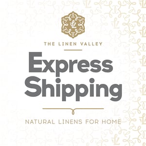 May include: The Linen Valley logo with a stylised floral design and the text "The Linen Valley" above the text "Express Shipping" and the text "Natural Linens for Home" below.