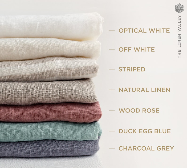 May include: A stack of eight linen fabric swatches in various colors, including optical white, off white, striped, natural linen, wood rose, duck egg blue, and charcoal grey. The swatches are arranged vertically with the names of each color listed to the right.