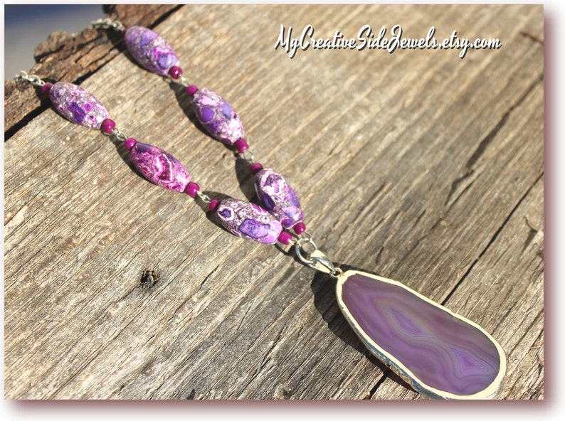 May include: A purple agate pendant necklace with a silver chain and purple and white patterned beads.  MyCreativeSideJewels.etsy.com