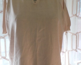 1970's cream knit polo shirt, open v at neckline, knit collar, short sleeves, banding at base and sleeves, quality knit