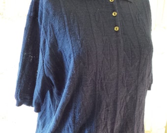 1970's navy knit polo shirt, 3 button front, knit collar, ribbed at base and sleeves, patterned knit