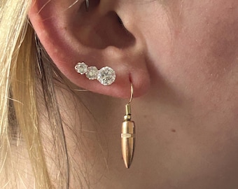 5.56 Pendientes de bala