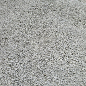 May include: A close-up view of a pile of small, white gravel. The gravel is smooth and uniform in size.