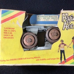 Patins à roulettes Flying Ace vintage des années 1970 scellés. NOS. Modèle intermédiaire #555