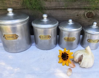 Set of 4 vintage French aluminium canisters with brass labels, nesting spice pots, 1940s kitchenalia, farmhouse kitchen decor