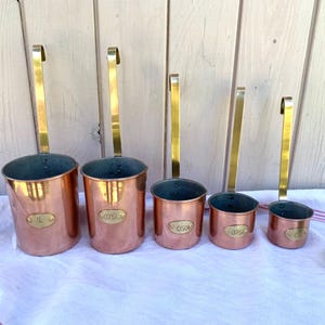 French vintage copper and brass hanging measuring ladles, brass name plates, country farmhouse kitchen decor