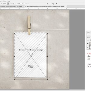 May include: A digital mockup template featuring a 5x7 inch rectangular card with a diagonal striped pattern and a central cut-out window. The card is suspended by a wooden clothespin on a thin string against a textured, light-colored background.