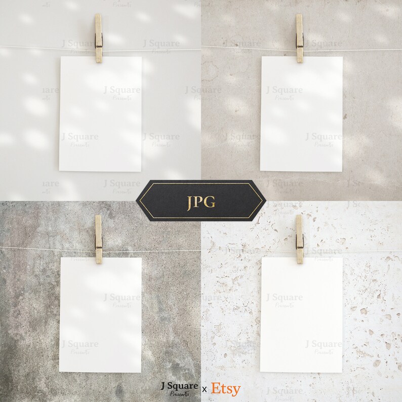 May include: Four vertical white rectangular cards hanging from a thin horizontal string by wooden clothespins. Each card is displayed against a different textured background, including smooth light gray, beige, dark gray stone, and white stone.
