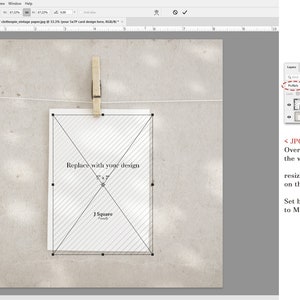 May include: A digital mockup template showing a white 5x7 card hanging from a string by a wooden clothespin. The card features a diagonal cross-hatch pattern with the text Replace with your design and J Square. The interface shows Adobe Photoshop.