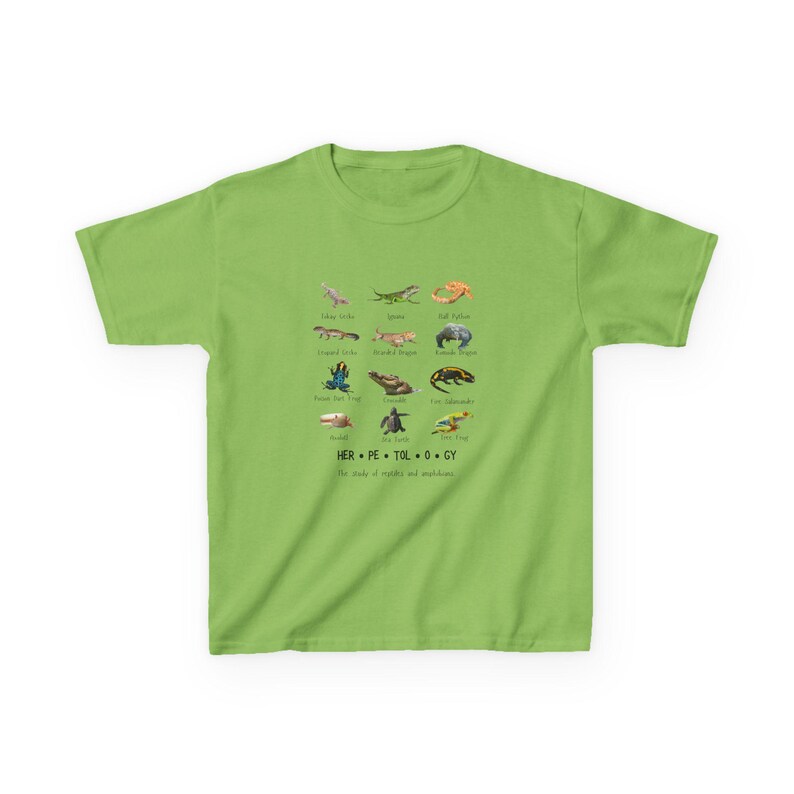 May include: A lime green t-shirt featuring a colorful illustration of various reptiles and amphibians. The design includes images of lizards, frogs, and salamanders, with the word "HERPETOLOGY" and the phrase "The study of reptiles and amphibians" printed below.